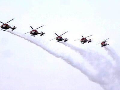 IAF's Sarang team comprising _Sq Leader Avinash_Sq Leader Karan_Team Leader and Group Capt SK Mishra and Wing Commdr Shridhar seen performinh aerobatics ovet Hussain Sagar Lake and Begumpet Area--01