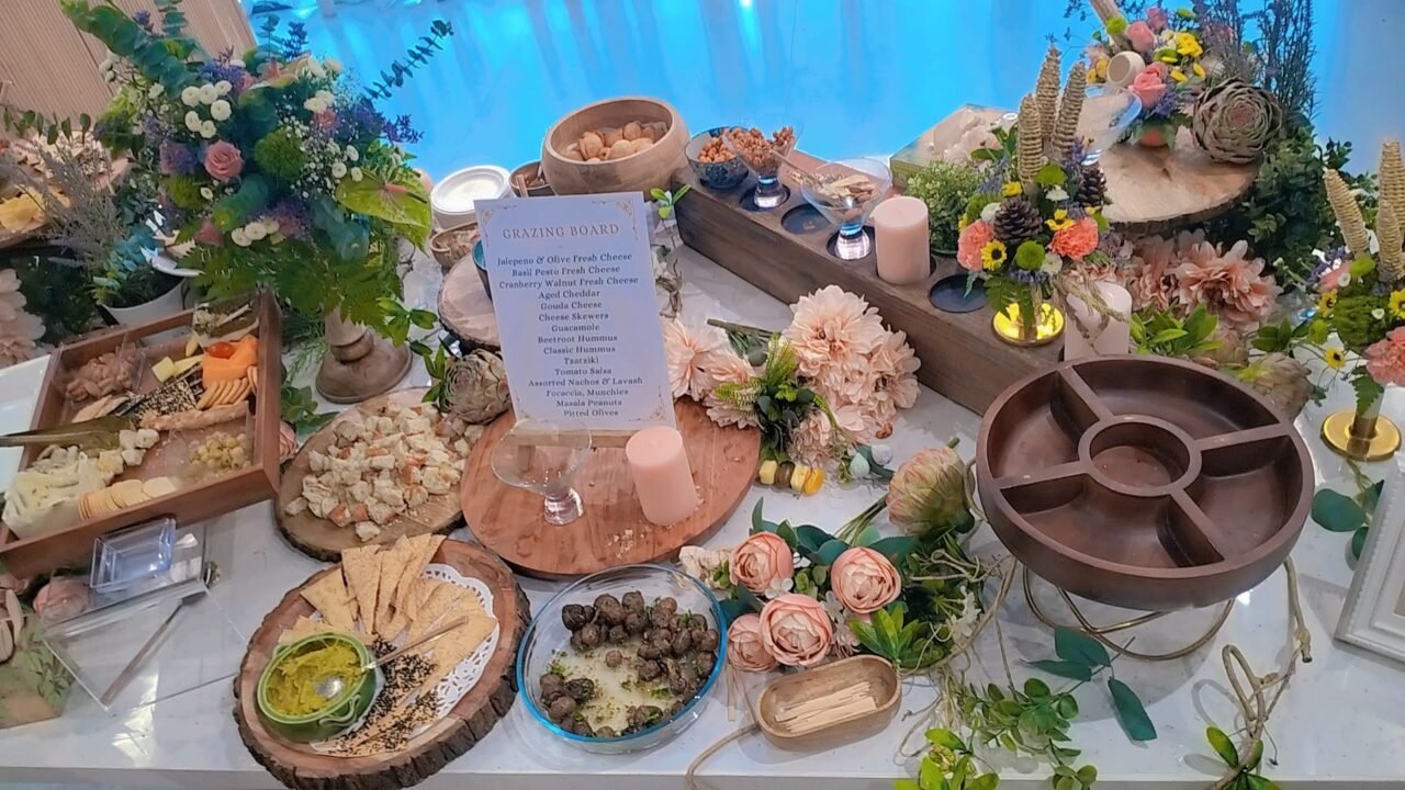 Curated Corridors at The Colosseum featuring a luxury grazing board with artisanal cheeses, beetroot hummus, nachos, masala peanuts, and gourmet starters by Cheese & Chase in Hyderabad