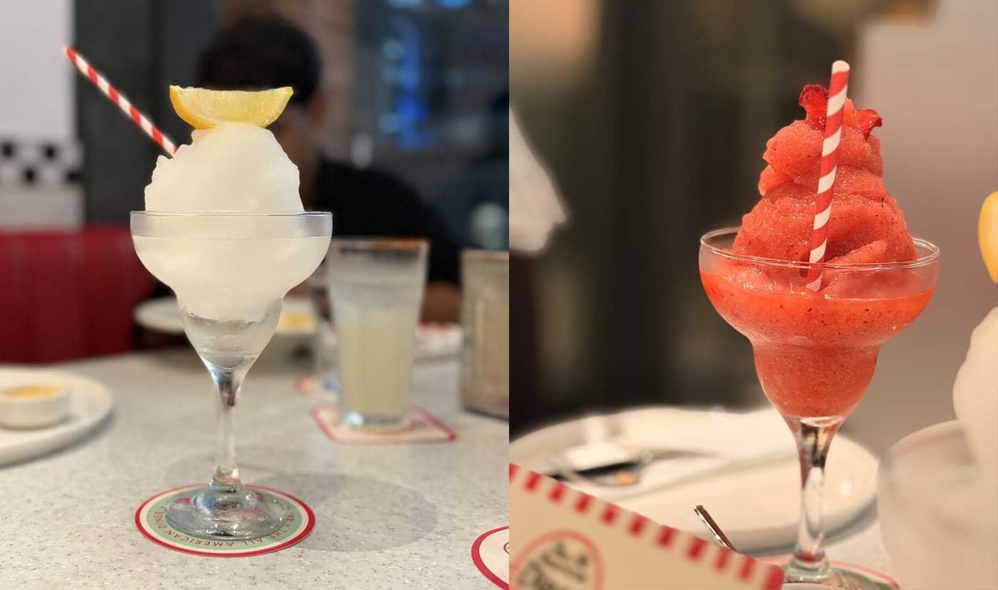 Frozen cocktails at our table: lemon-topped, and strawberry.